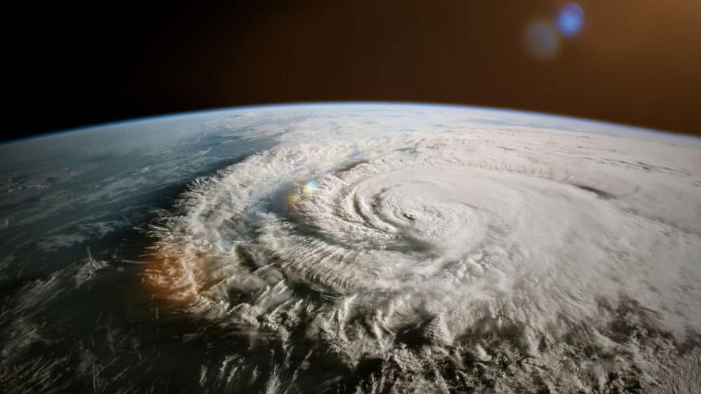 Satellite view of a swirling hurricane over the Earth's surface.